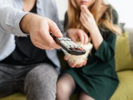 Man Holding Remote Control