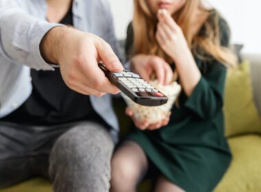 Man Holding Remote Control