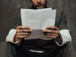 A Prisoner Reading a Letter