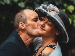 Man Kissing Woman