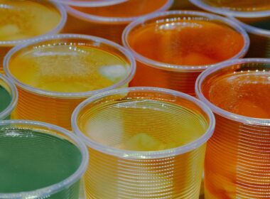 clear glass jars with yellow liquid