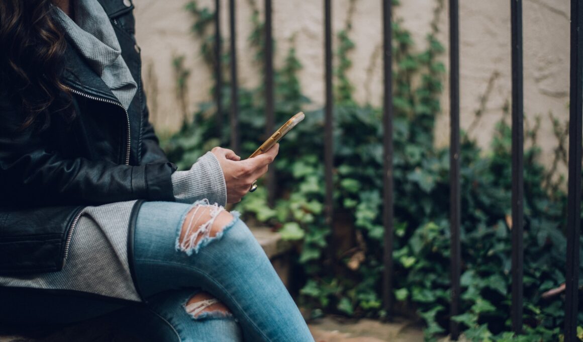 woman using gold smartphone