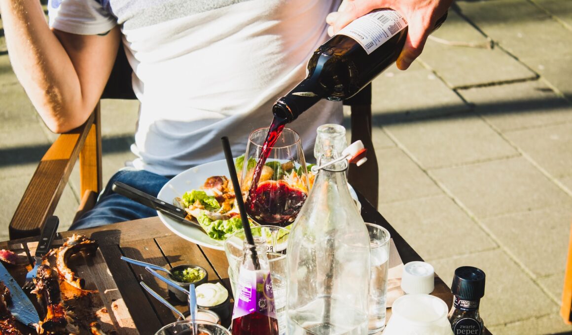 man sitting while pouring wine