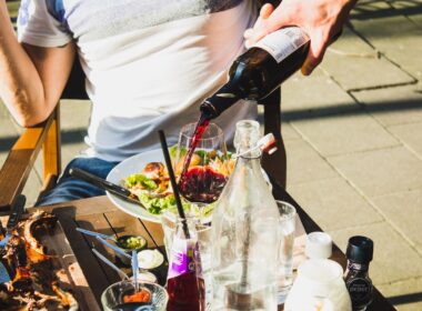 man sitting while pouring wine