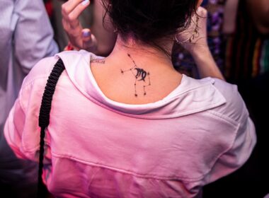 a woman with a tattoo on her back