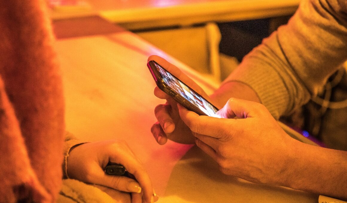 person holding silver iphone 6