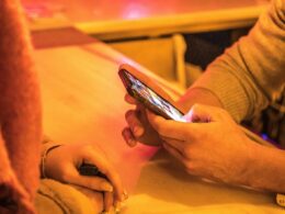 person holding silver iphone 6