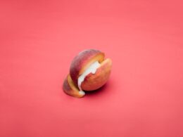 sliced apple fruit on pink surface