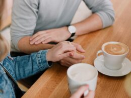 man and woman holding hands