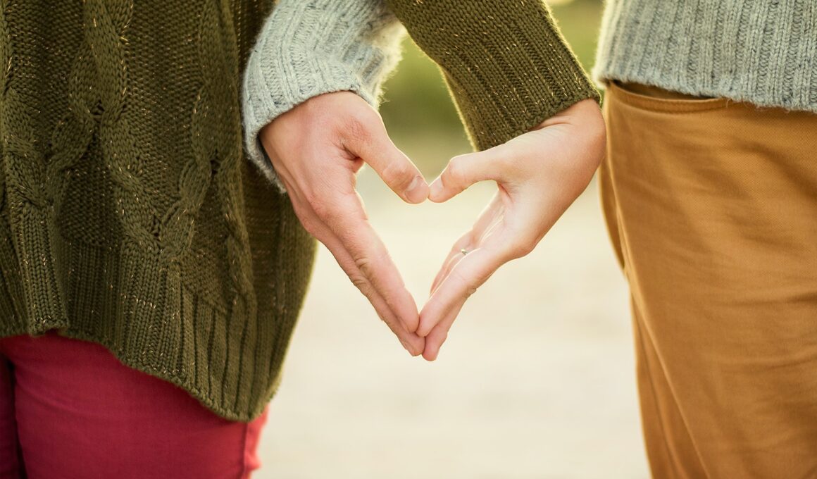 person forming heart shape with their hands