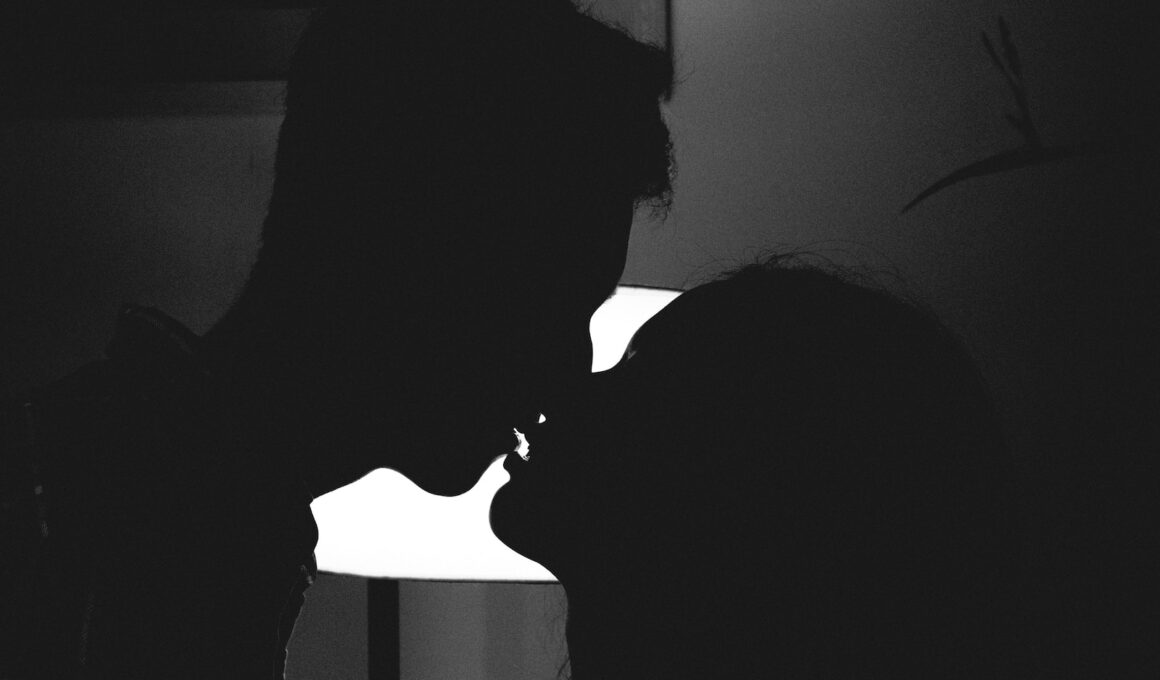 silhouette of man and woman kissing