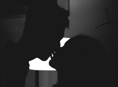 silhouette of man and woman kissing