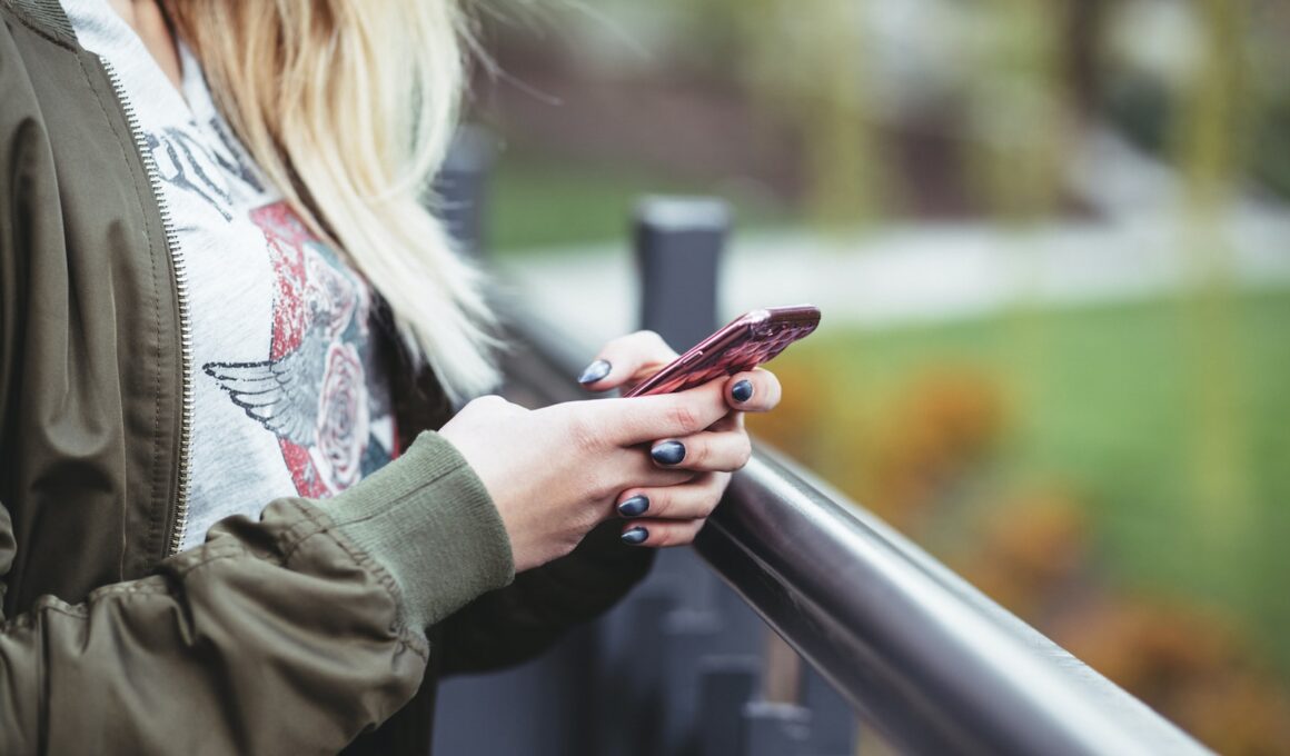 woman holding red phone