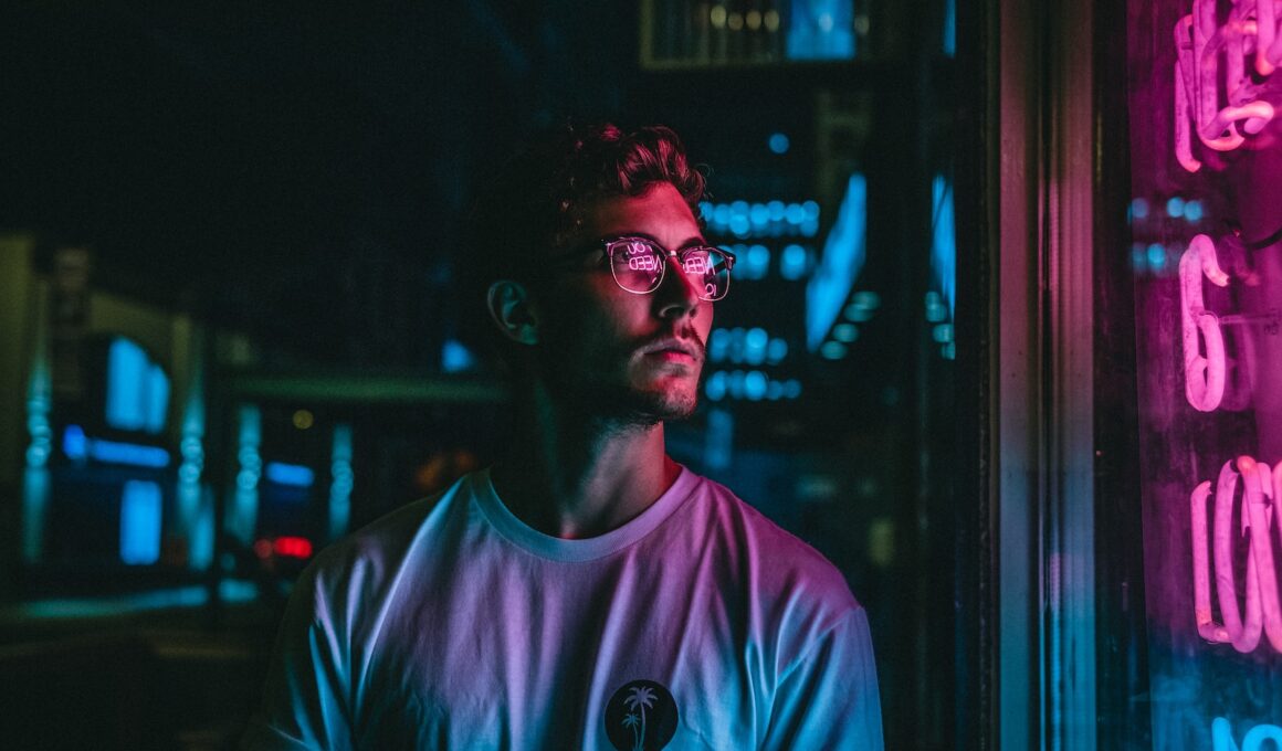 man looking at glass storefront windowpane during night