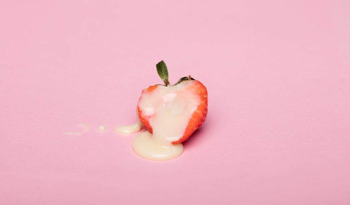 red cherry fruit on pink surface