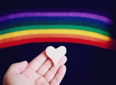 person holding white heart shaped ornament