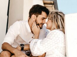 smiling man and woman about to kiss