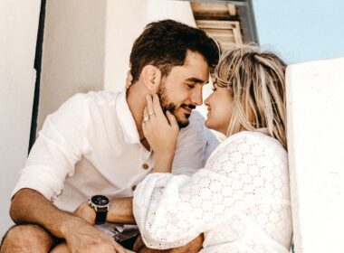 smiling man and woman about to kiss