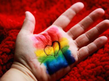 blue green and red thread on persons palm