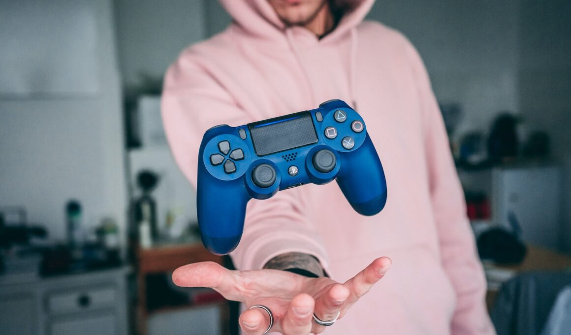 person holding blue Sony PS4 Dualshock 4 c