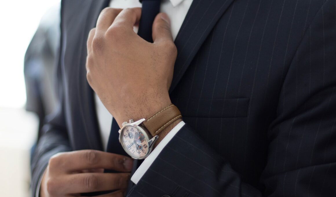 man wearing watch with black suit