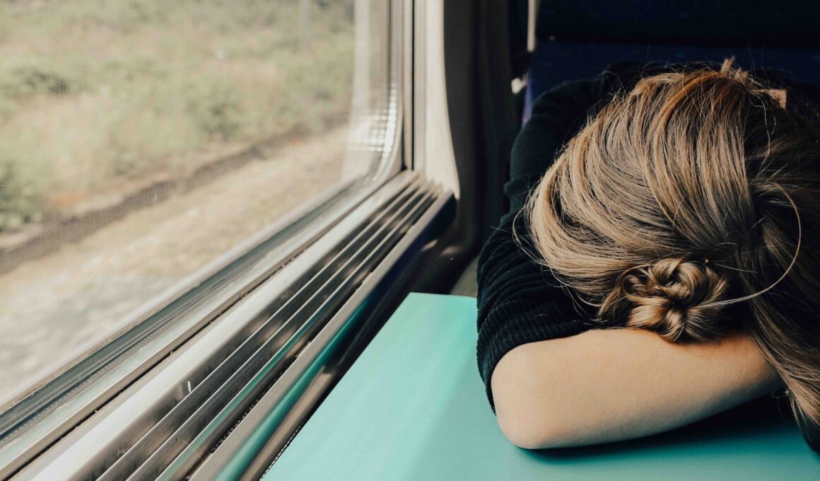 sleeping woman in train at daytime